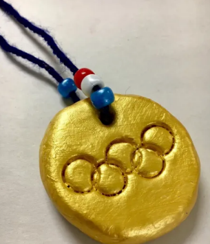 Gold olympic medal made from clay